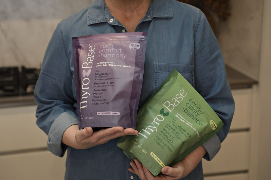 Hands holding the ThyroBase AM and PM pouches